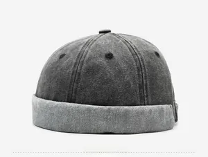 Detail view of the washed cotton brimless docker hat with two-tone grey splicing design