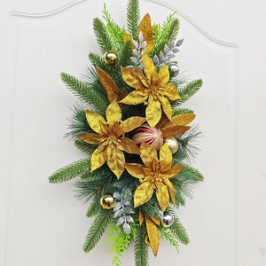 Christmas staircase swag with gold flowers, red ornaments and faux pine needles