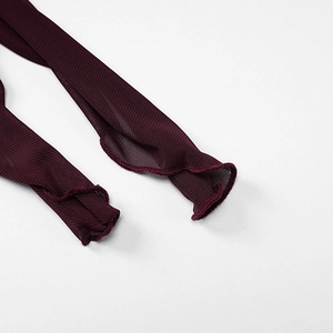Detailed close-up of dark red mesh fabric with fine ruffled edges and textured netting