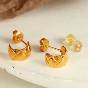 Minimalist gold quilted C-shaped titanium steel stud earrings with premium metallic texture