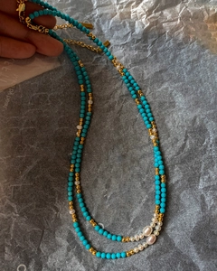 Close-up of 18K gold plated necklace with turquoise beads and freshwater pearls