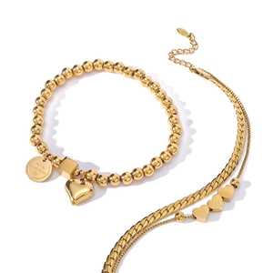 Polished gold stainless steel layered necklace and heart pendant bracelet set
