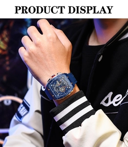 Detailed view of the multi-functional quartz watch with blue silicone strap on wrist