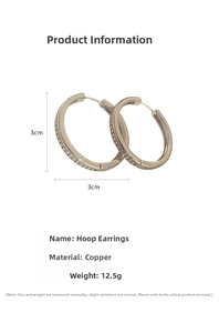 Detail view of silver geometric hoop earrings with rhinestones measuring 3cm in diameter