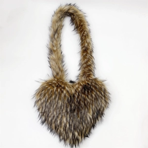 Macro shot of brown faux raccoon fur texture on a heart-shaped crossbody shell bag