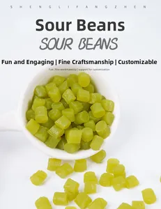 Detailed view of miniature green resin sour beans on white porcelain spoon for dollhouse