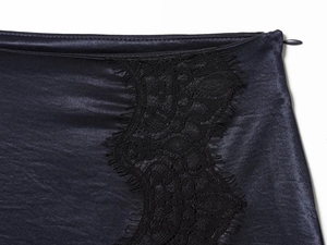 Detail of dark blue satin fabric with black lace trim and hidden zipper on mini skirt