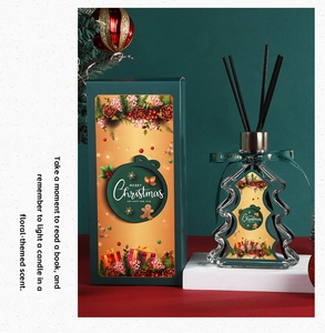 Christmas tree shaped reed diffuser set in dark green gift box with festive illustration