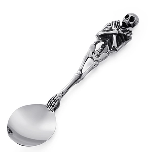 Gothic skull handle stainless steel spoon with polished silver finish on white background
