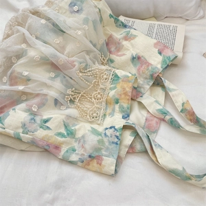 Detailed shot of floral linen tote with delicate lace trim and embroidered mesh overlay