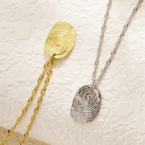 Creative fingerprint pendant necklace in gold and silver finish with twisted rope chain