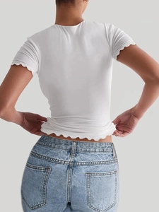 Detail of white short sleeve yoga T-shirt featuring stylish lettuce edge hem and back view
