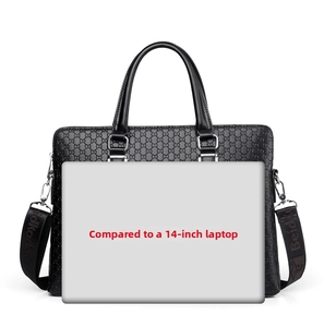 Black business briefcase showing size compatibility with a 14-inch laptop computer