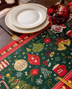 Detailed weave of jacquard Christmas table runner with Merry Christmas motif and tassels