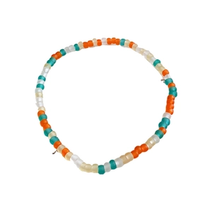 Three-piece colorful bead jewelry set with matte green and orange beads on white background