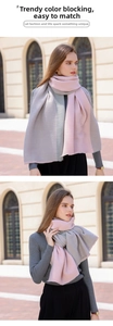 Detail of pink and grey ribbed cashmere-like scarf showing soft texture and bicolor design
