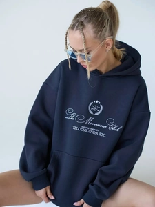 Detail of The Movement Club letter print on navy blue oversized hooded sweatshirt
