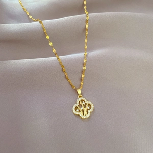 Titanium steel four-leaf clover necklace with sparkling rhinestones on golden chain