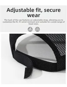Detail of adjustable velcro strap and breathable mesh fabric on black baseball cap