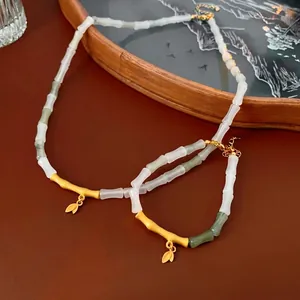 Bamboo style necklace and bracelet set with green jade beads and golden leaf charms
