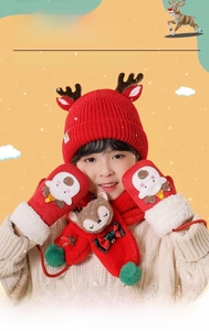 Detailed view of kids red Christmas knit hat, scarf and gloves set with elk decor