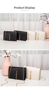Close-up of quilted shoulder bags with gold chains and elegant tassel hardware detail