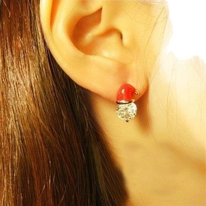 Christmas snowman hat earrings with red oil drip and white zircon on model ear
