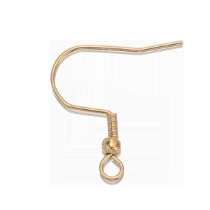 Close-up of golden stainless steel earring hooks with spring and loop for DIY jewelry making