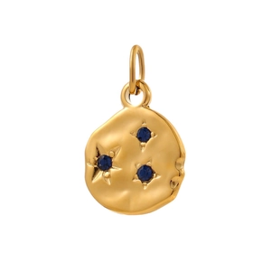 Golden round hammered pendant with three star-set blue gems on a white background