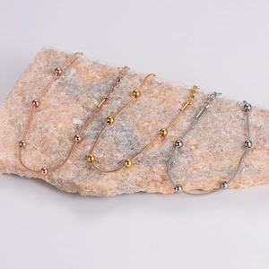 Minimalist stainless steel bead bracelet set in rose gold, gold, and silver finishes