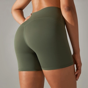 Detail showing high-waisted olive green yoga shorts with scrunch butt lift design