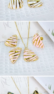 Detailed view of enamel zebra pattern jewelry sets in gold, pink, and dark green colors