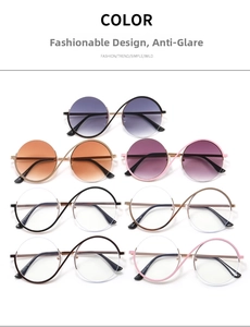 Detailed view of metal round half-frame glasses in multiple colors with cross bridge design