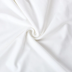 Vue macro de la texture du tissu en maille blanche montrant le tissage de qualité supérieure