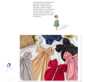Detailed view of large silk satin bow hair clips in multiple elegant color options