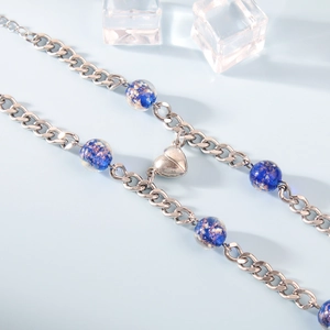 Luminous blue glass bead Cuban link bracelet with heart magnet charm on ice