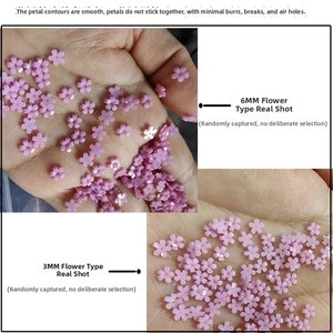 Detail of pink resin 5-petal flower nail charms in 3mm and 6mm sizes for DIY crafts