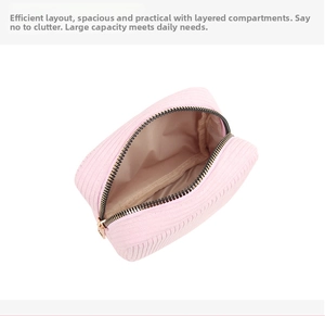 Detailed view of pink corduroy makeup bag interior with metal zipper and lining