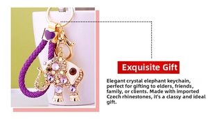 Detailed view of crystal-encrusted elephant keychain with purple woven strap and heart charm