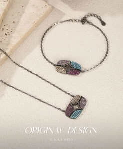Detail of S925 silver jewelry set featuring star pendants with colorful cubic zirconia