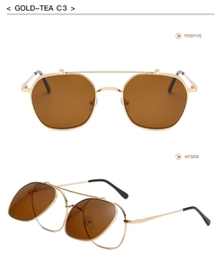 Detail view of gold metal flip-up sunglasses with tea lenses in dual display