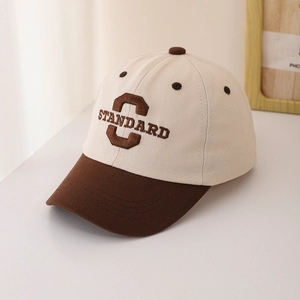 Close-up of retro letter C embroidery on two-tone cotton kids baseball cap