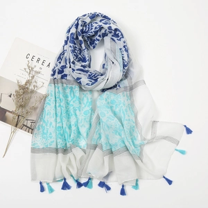 Detail of floral print linen scarf with matching tassels and light breathable texture