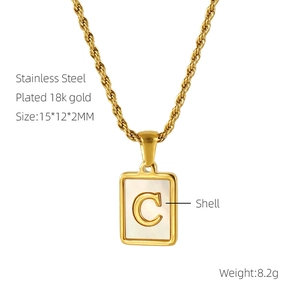 Detail of square shell pendant with 18k gold plating, letter C, and size specifications