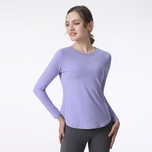 Women's lavender long-sleeve yoga top with breathable crew neck and curved hem design
