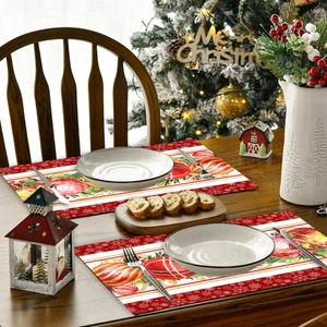 Christmas placemats with red and white snowflake patterns on a rustic wooden dining table