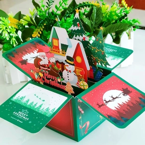 Detail of 3D Christmas pop-up card featuring laser-cut Santa, reindeer, and festive trees