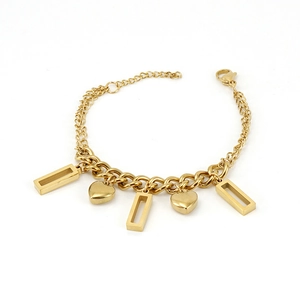 Macro shot of 18K gold plated steel bracelet with heart and rectangle charms