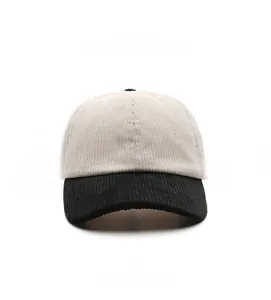 Detail view of corduroy baseball cap with beige crown and contrasting black brim