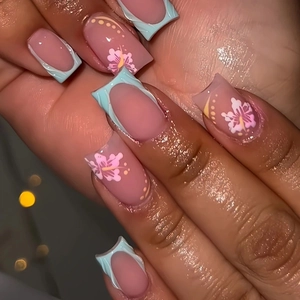 3D floral press-on nails with pink and blue French tips and hibiscus flower art